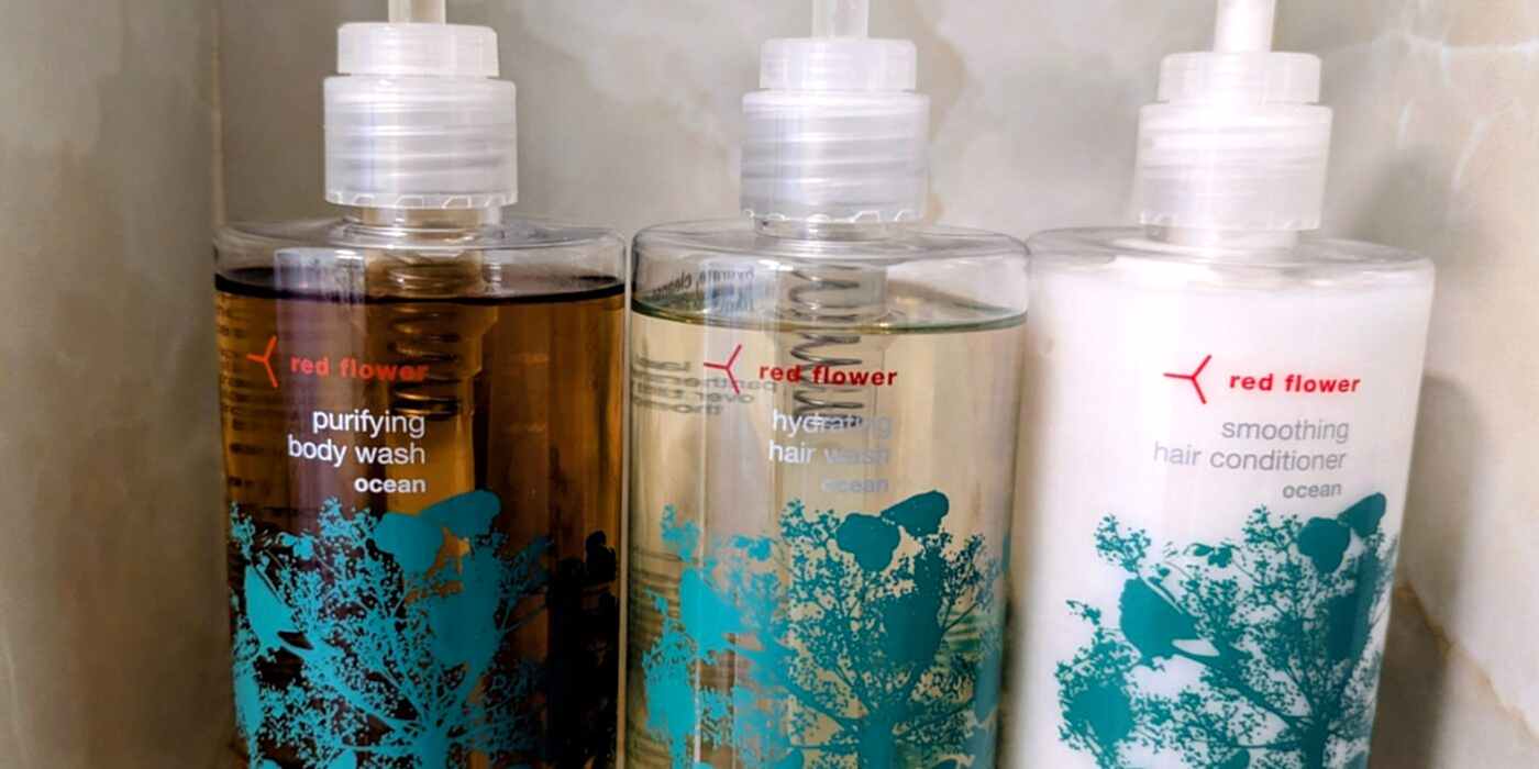 Red Flower Toiletries on Shower Shelf