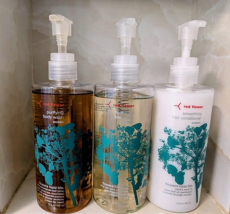 Red Flower Toiletries on Shower Shelf